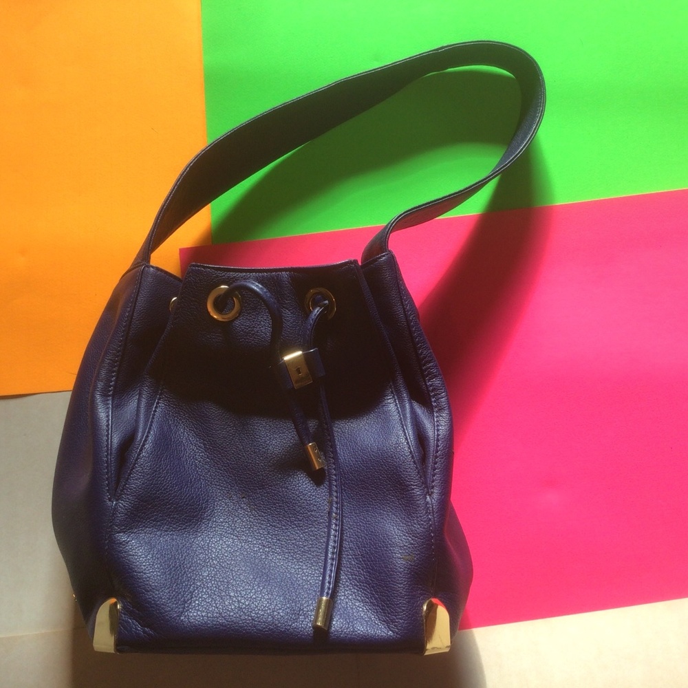 Vince Camuto navy blue leather  bag with gold accents
